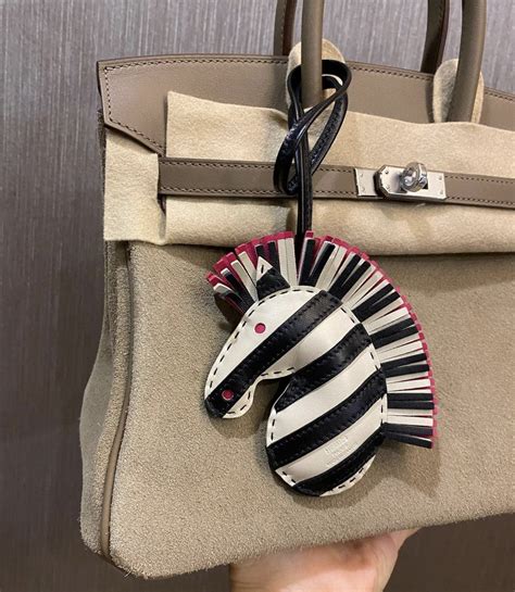 hermes zebra bag charm|Hermes twilly on bag.